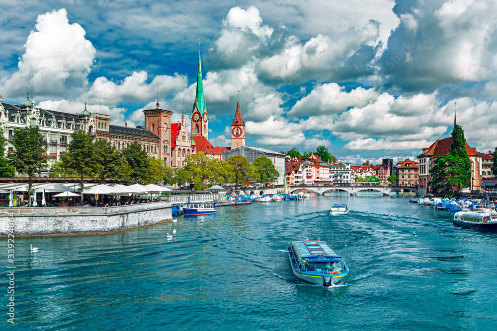 Scenic view of historic Zurich city center with famous Fraumunster and Grossmunster Churches and riv