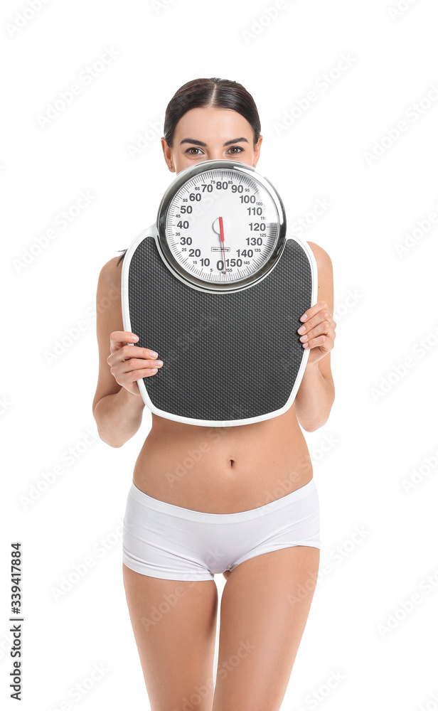 Young woman with scales on white background. Weight loss concept