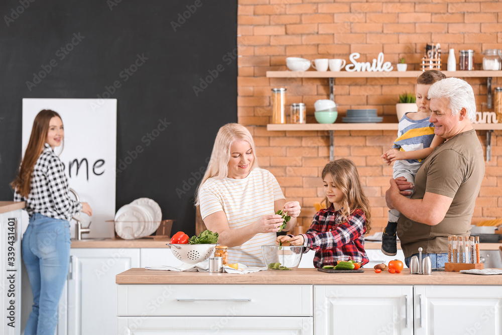 Big family cooking together in kitchen