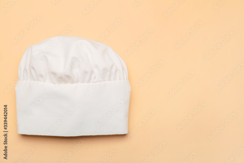 Chefs hat on color background