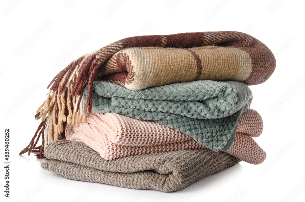 Soft blankets on white background