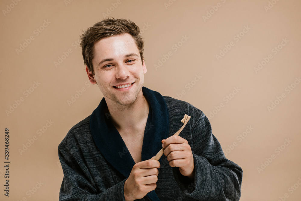 Man holding toothbrush