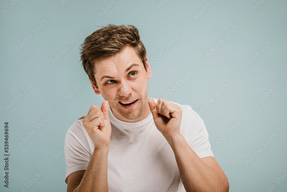 Man using dental floss