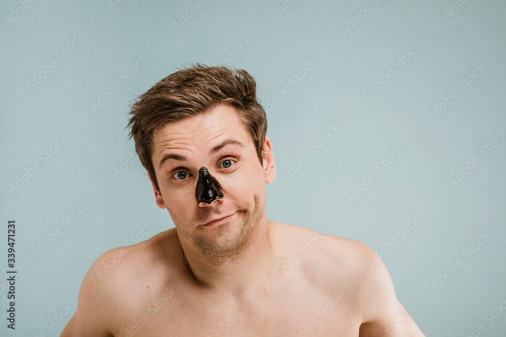 Portrait of a man wearing black pore mask