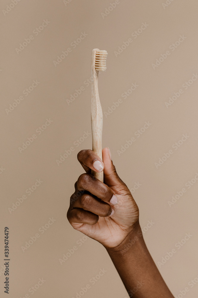 African woman holding tooth brush