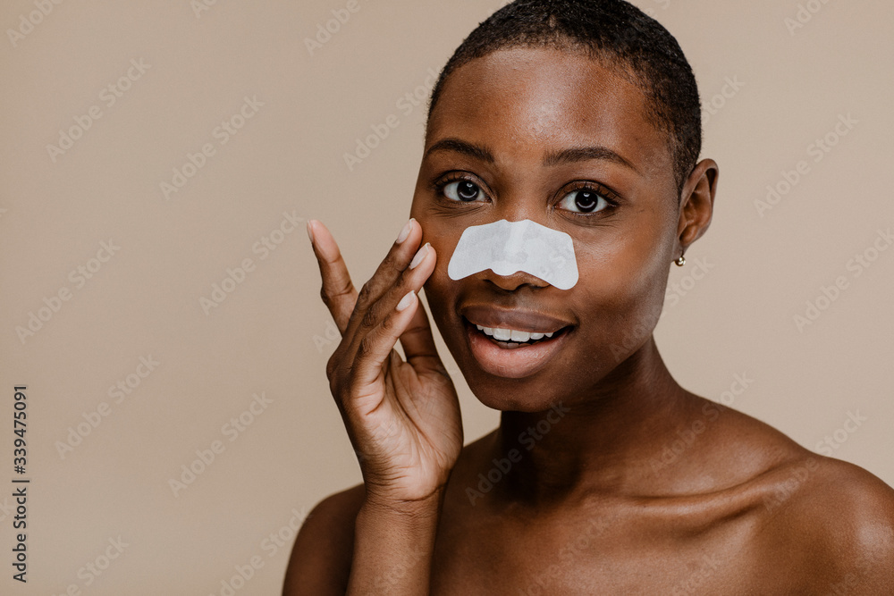 African woman using nose strip