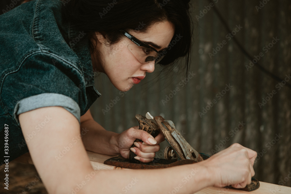 Carpenter shaving off wood