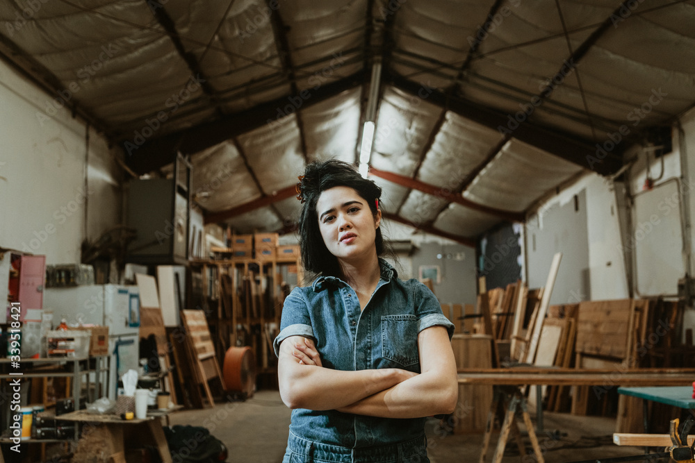 Professional female carpenter posing