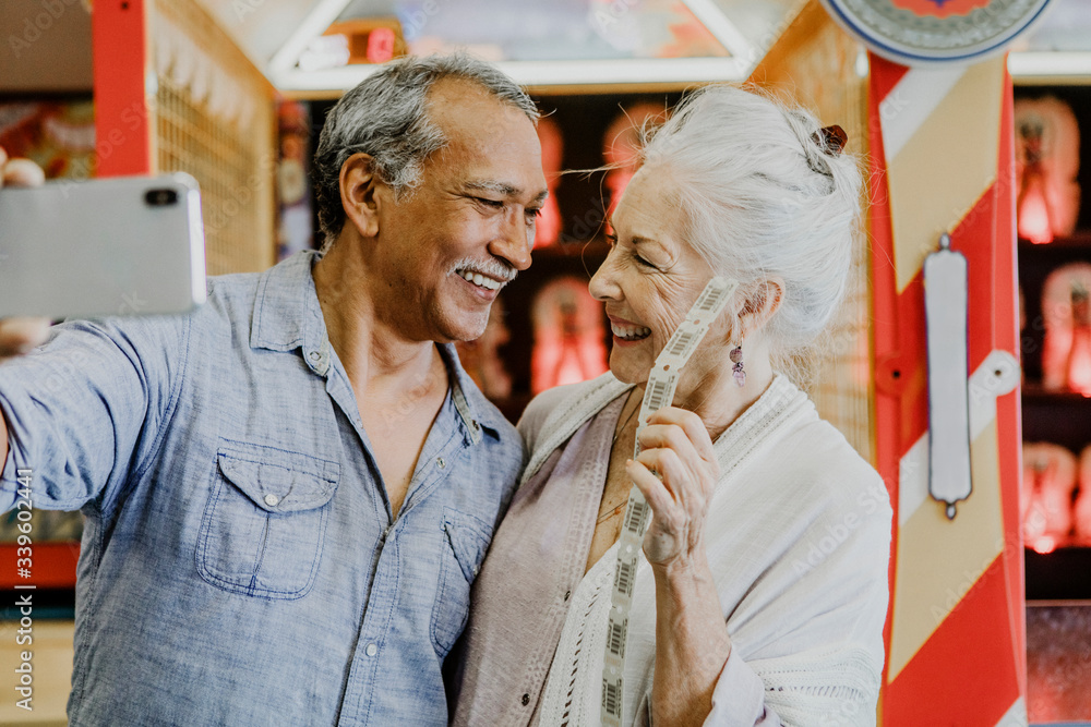 Happy retired couple taking a selfie