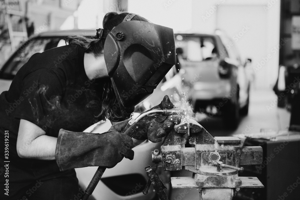 Woman welding metal