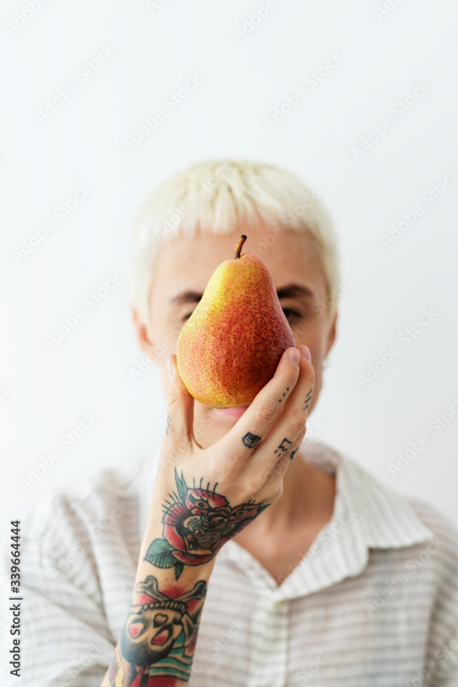 Woman holding a pear