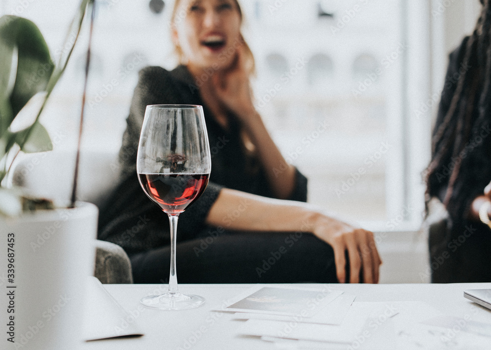 Classy businesswomen enjoying wine