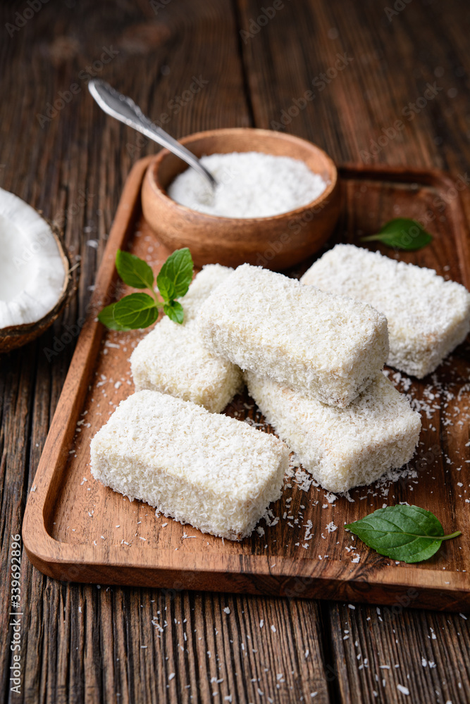 Delicious sweet dessert, white chocolate Lamingtons covered in grated coconut