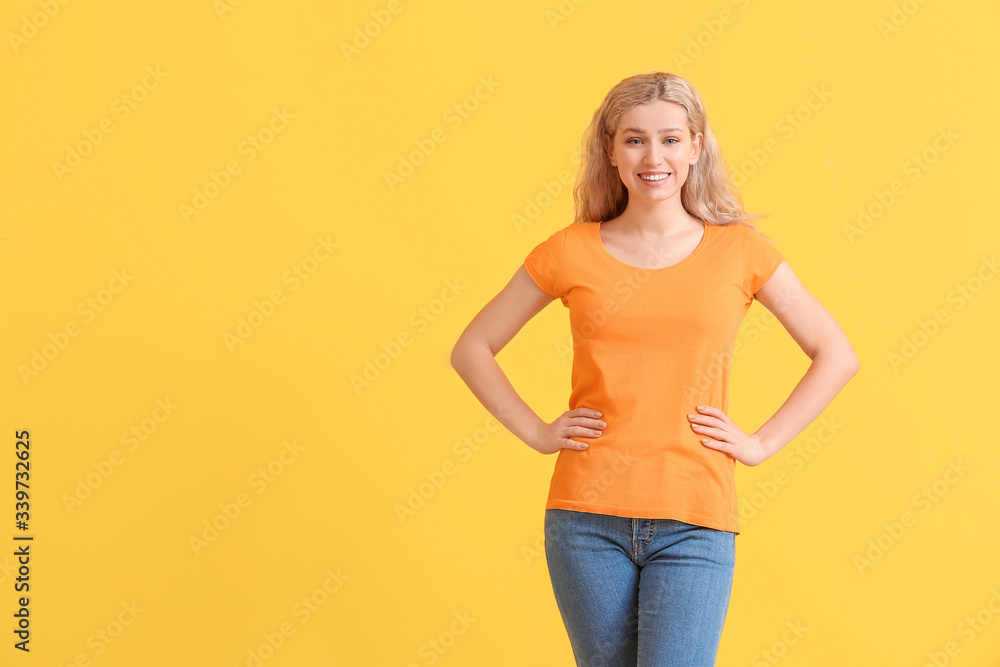 Woman in stylish t-shirt on color background