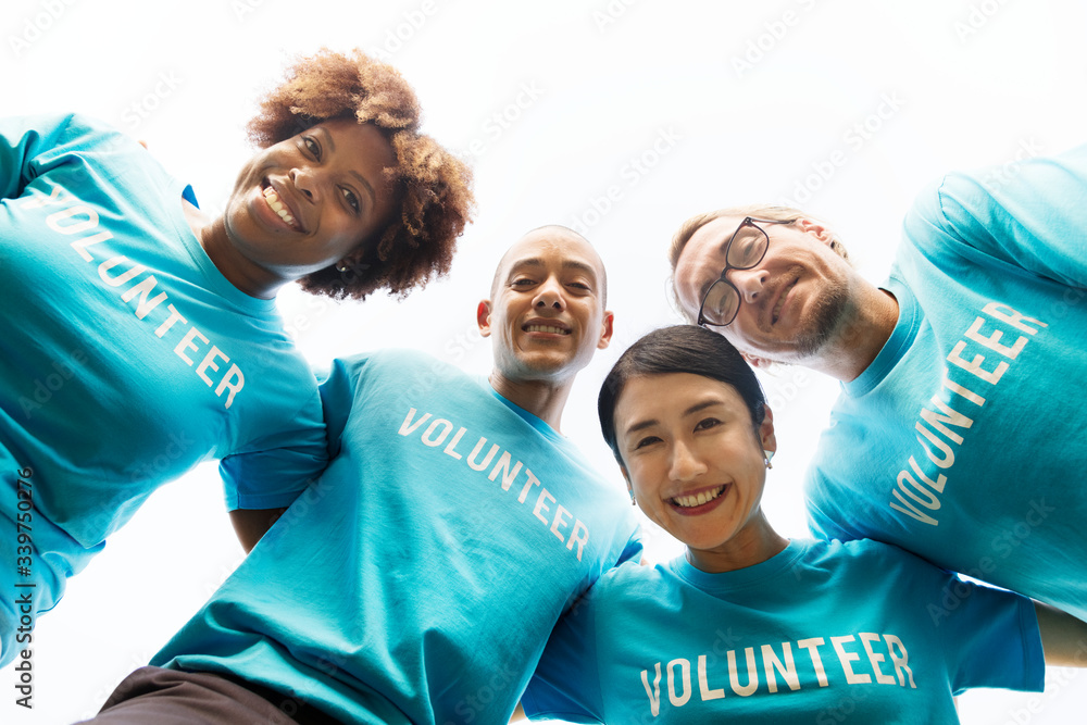 Group of happy and diverse volunteers