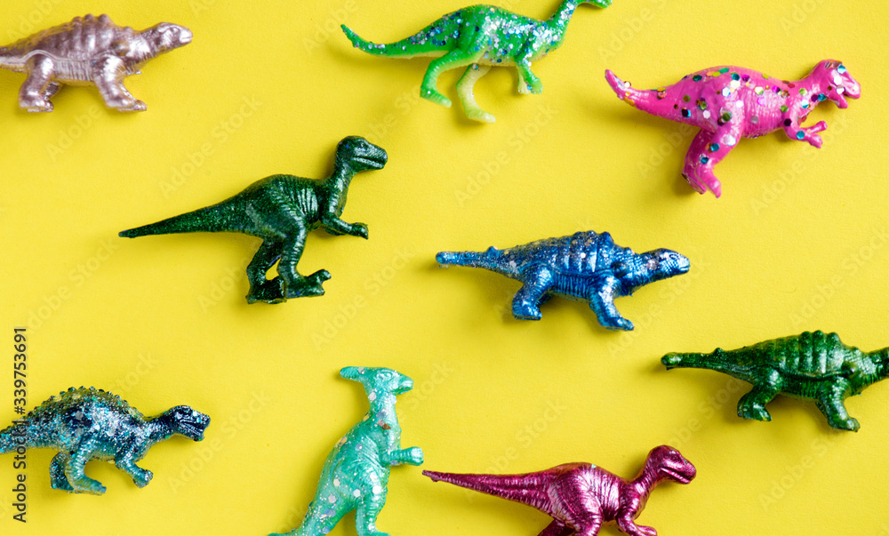 Various animal toy figures in a colorful background