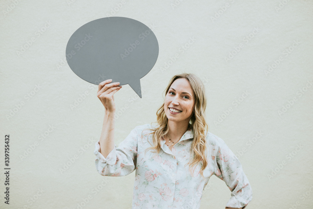 Woman holding speech bubble