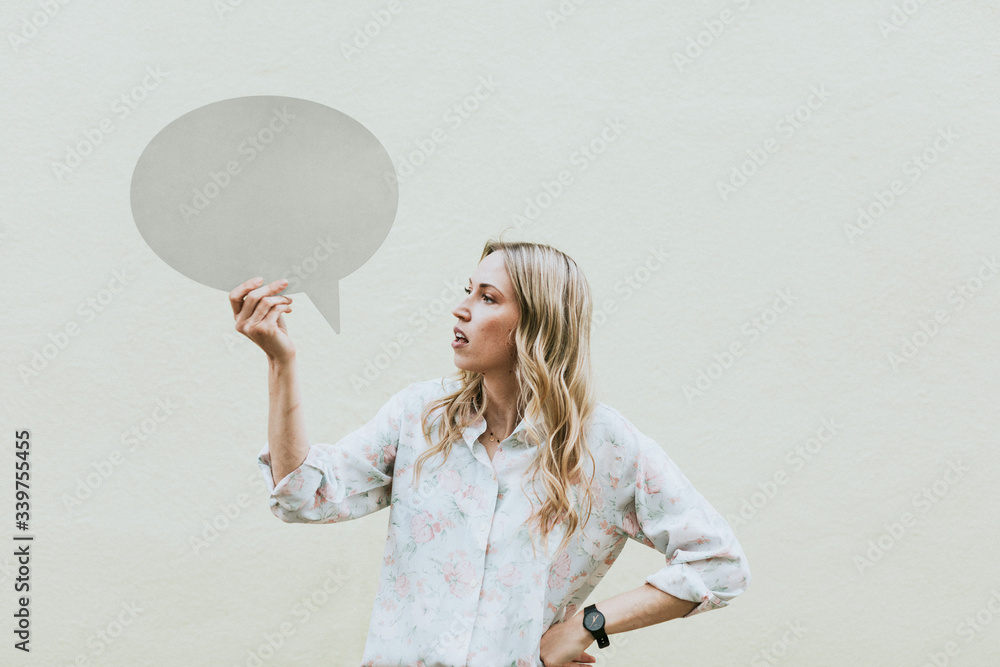 Woman holding speech bubble