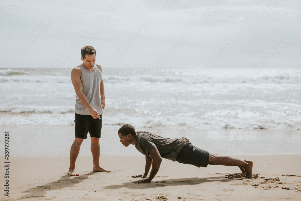 Man training by the beach