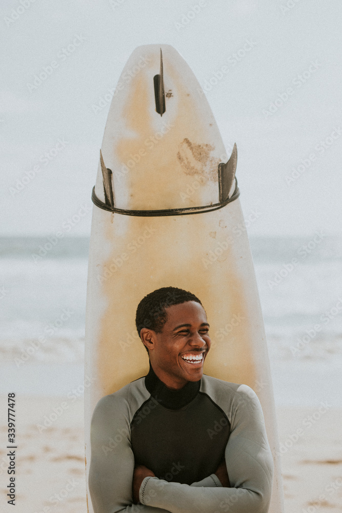 Smiling professional surfer