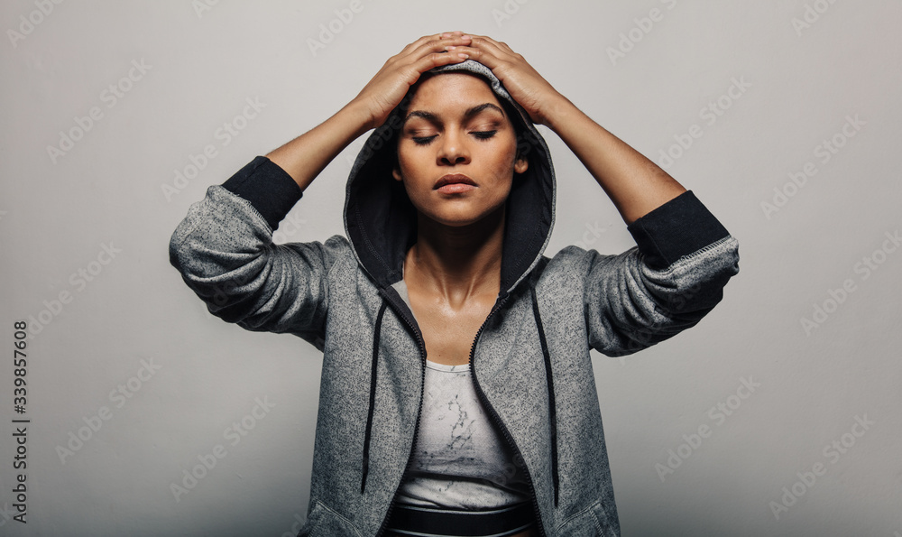 Sportswoman wearing a hoodie jacket