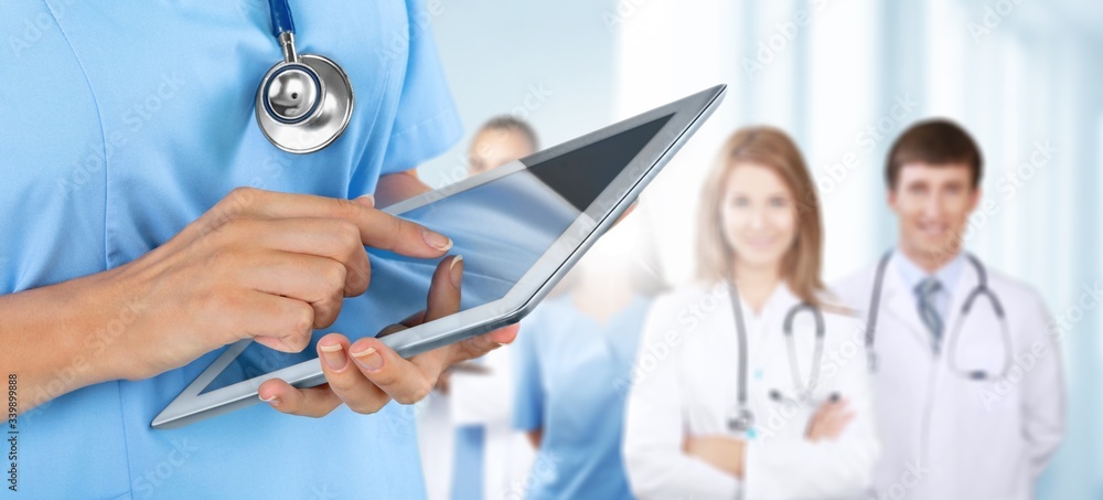 Doctor at a hospital working with tablet pc