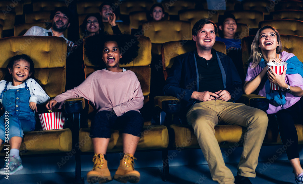 People audience watching movie in the movie theater cinema. Group recreation activity and entertainm