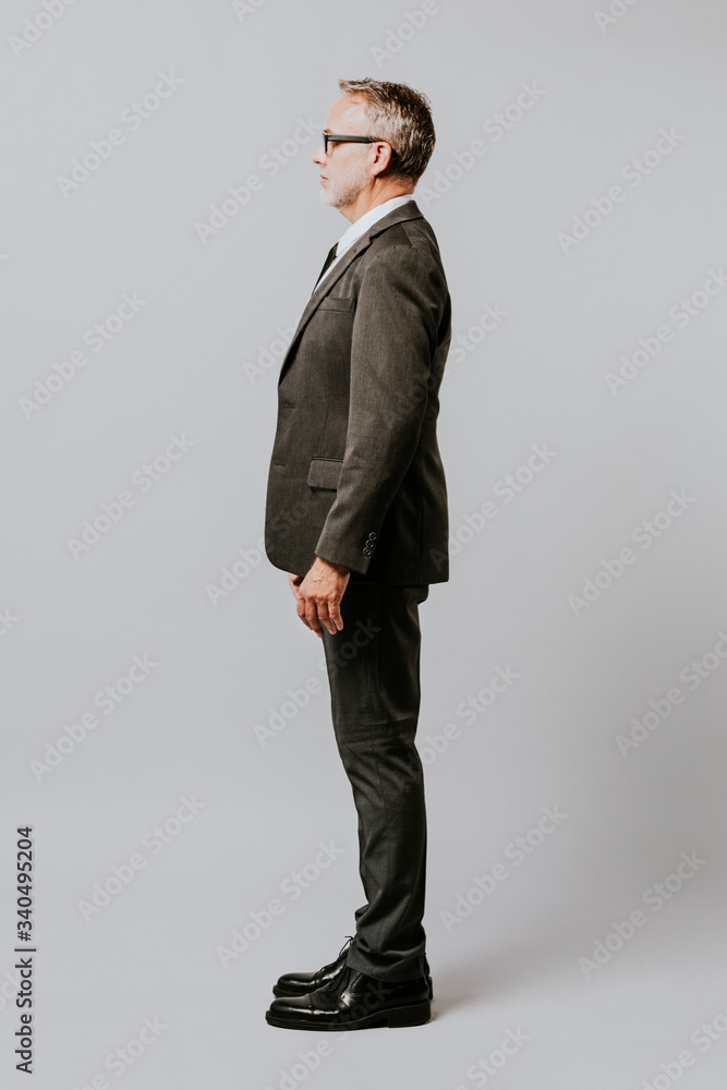 Businessman full body side portrait