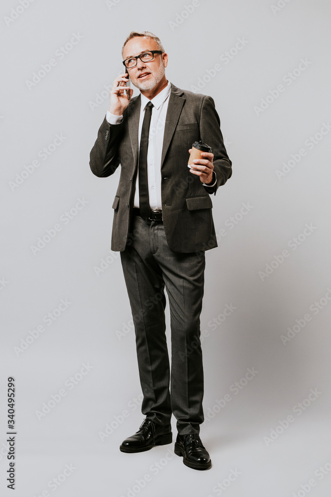 Man in a suit talking in a mobile