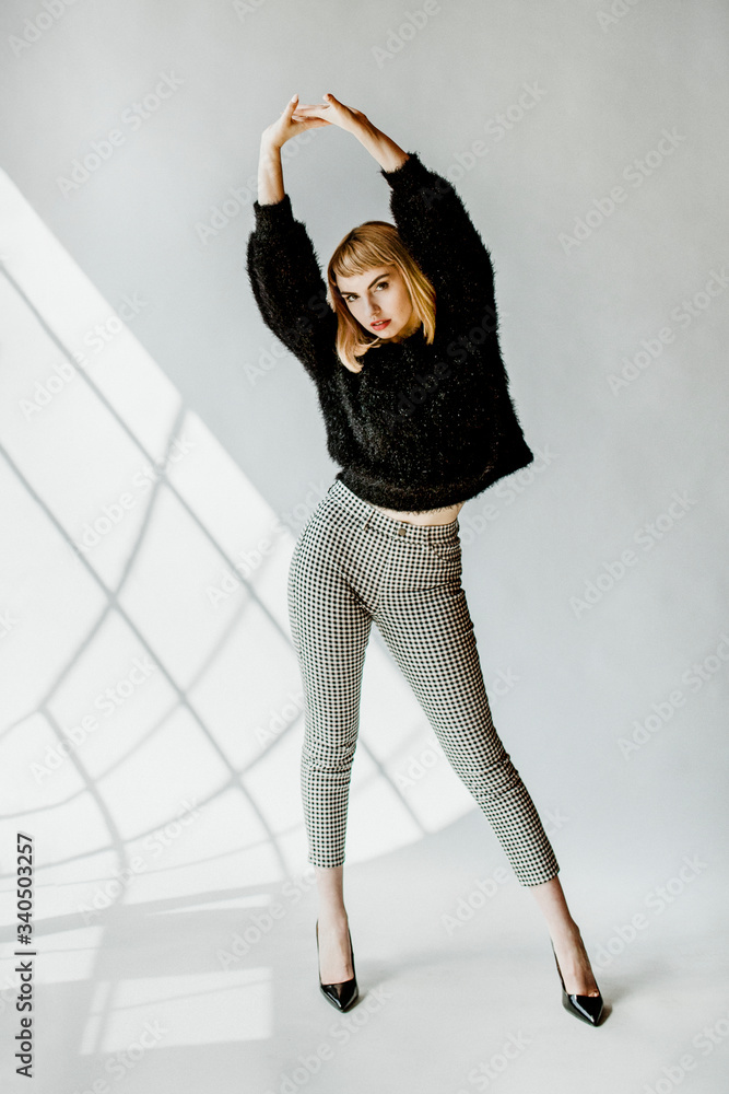 Model posing in a natural light studio