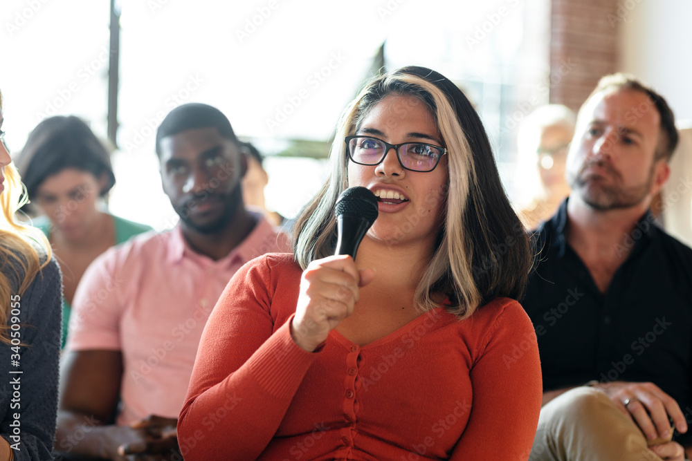 Woman holding a microphone