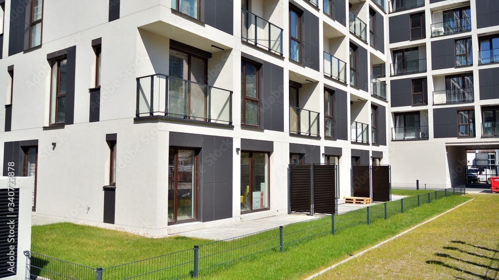 Modern apartment building on a sunny day with a blue sky. Facade of a modern apartment.