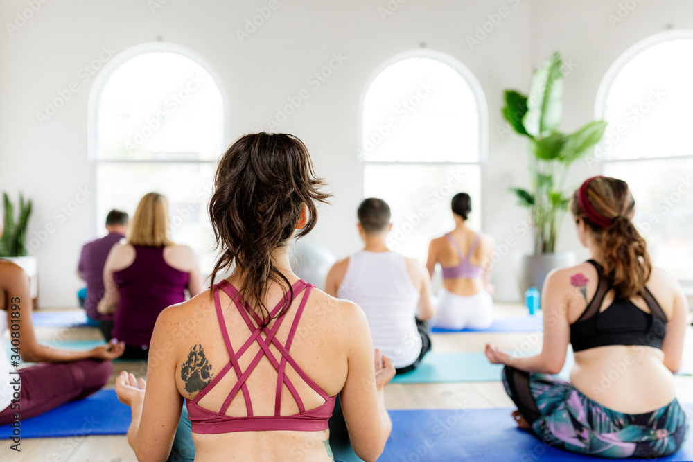 People sitting in a yoga pose