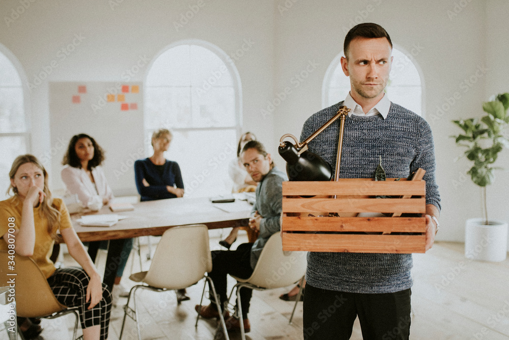 Angry businessman with a wooden box