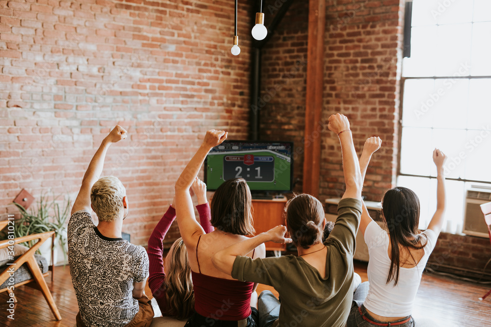 Friends cheering on their team