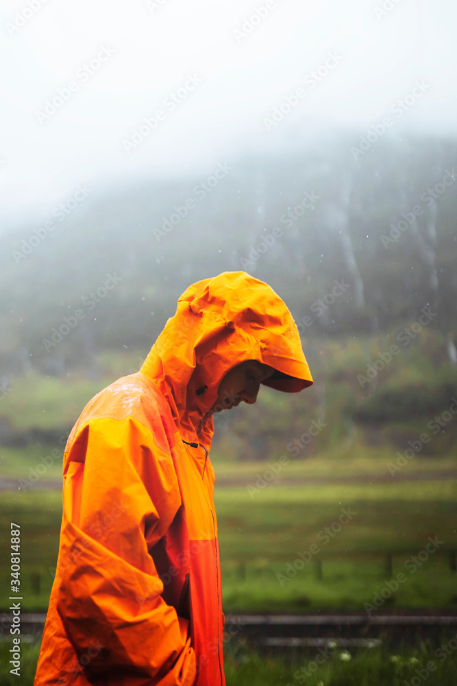 Orange raincoat in the rain