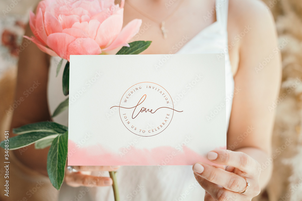 Woman holding a card with flowers