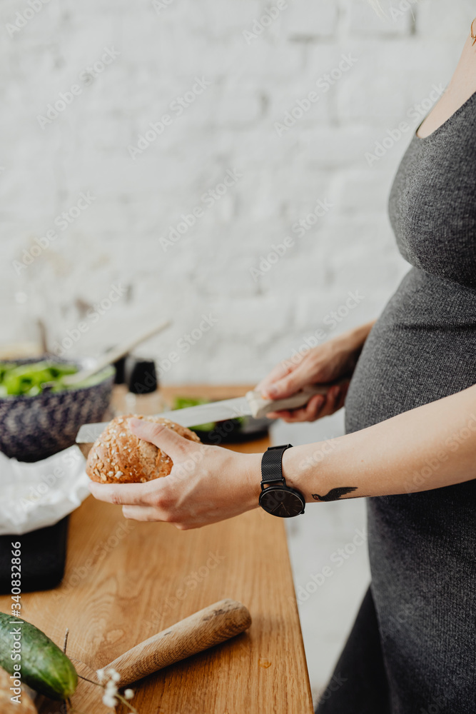 Pregnant woman making breakfast