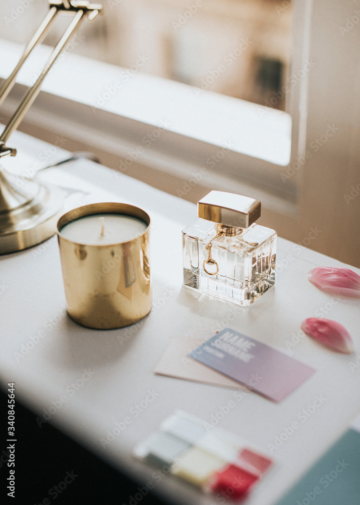 Feminine perfume bottle and candle