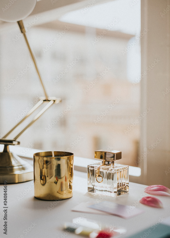 Feminine perfume bottle and candle