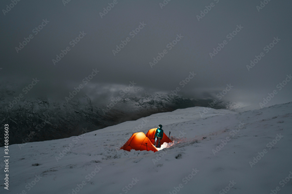 Camping in a tent during winter