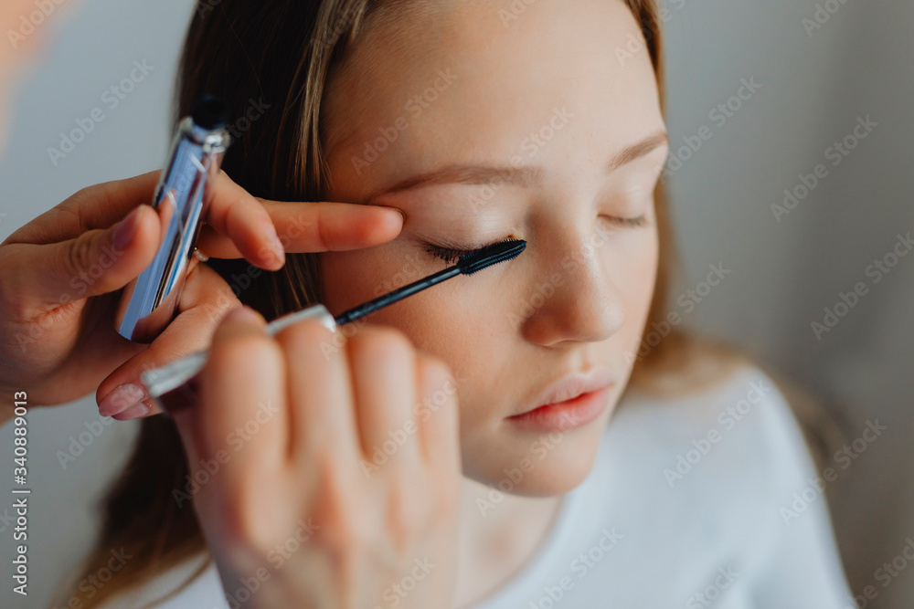 Applying black mascara