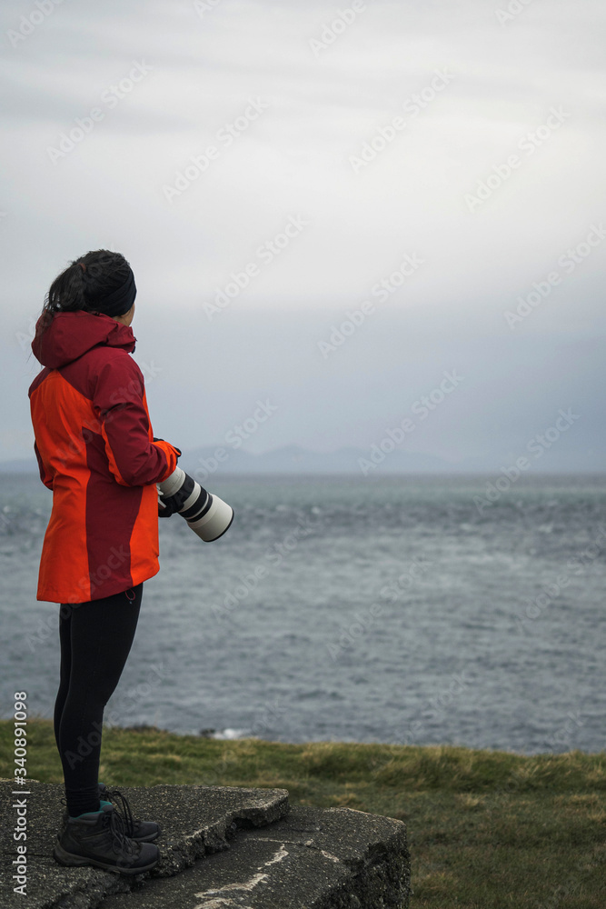 Travel photographer by the sea