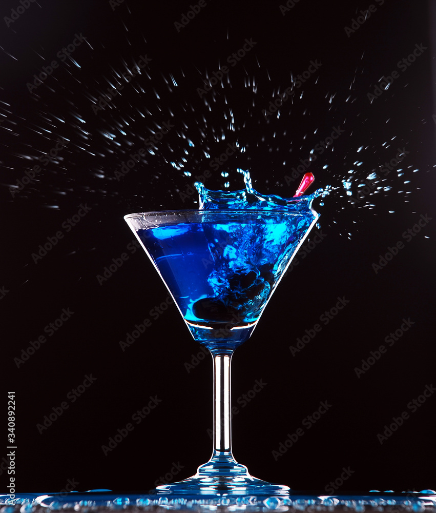 blue cocktail splashing