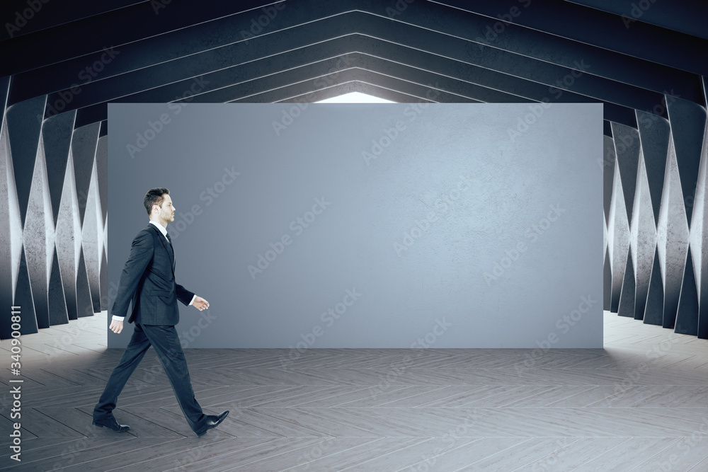 Businessman walking in gallery interior