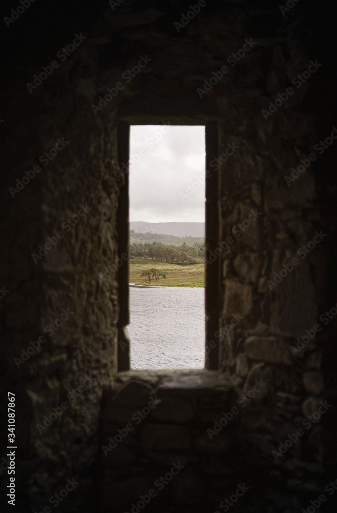 Lake through castle ruins