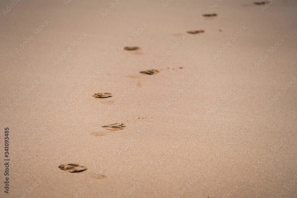 Sandy beach with footprints