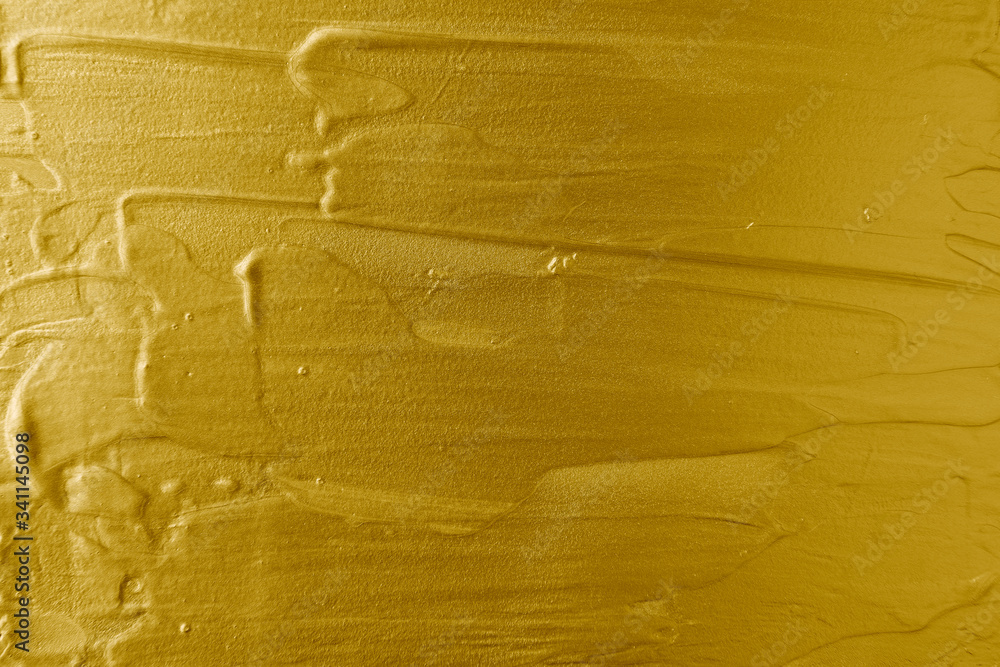 Metallic gold paint brushstroke