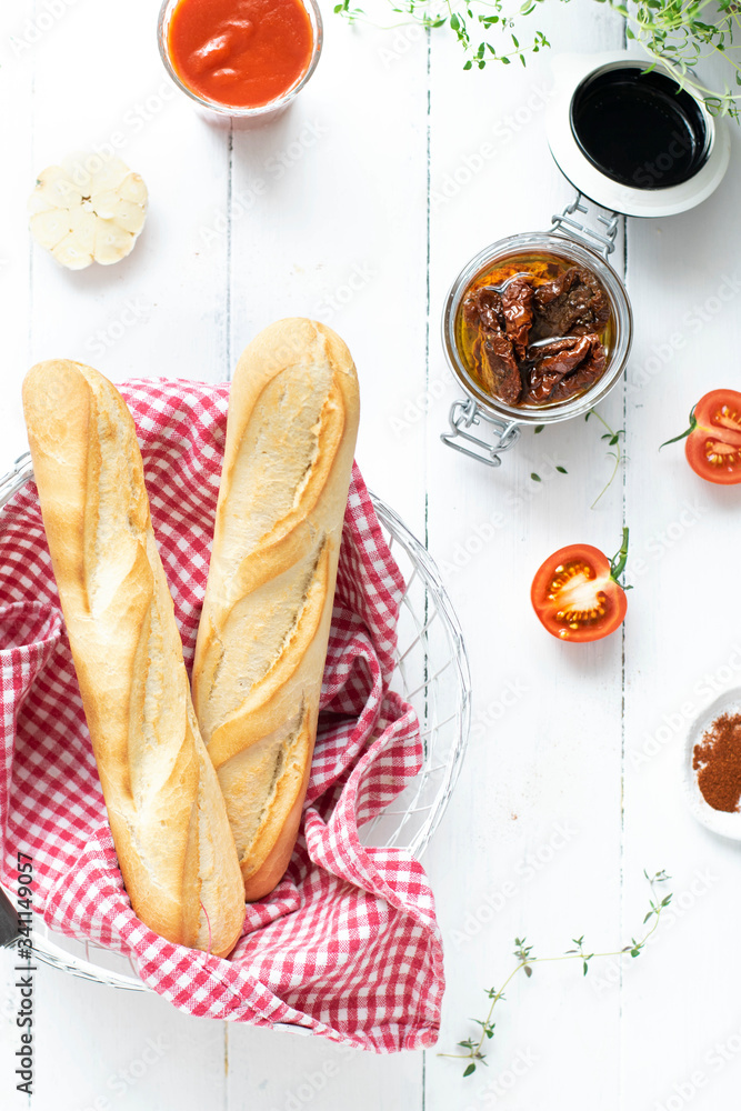 Fresh baguette on a white table