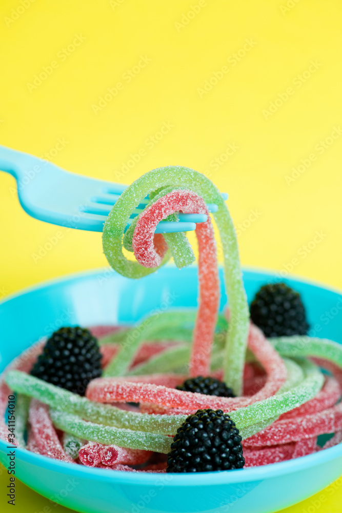 Closeup of colorful jelly worms shown as spaghetti